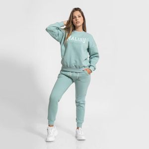 Conjunto mujer buzo afranelado polera y jogger turquesa Arcoi